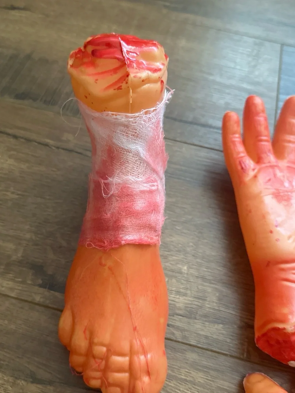 Fake Severed Hand and Foot Halloween Props - Bloody Orange Set